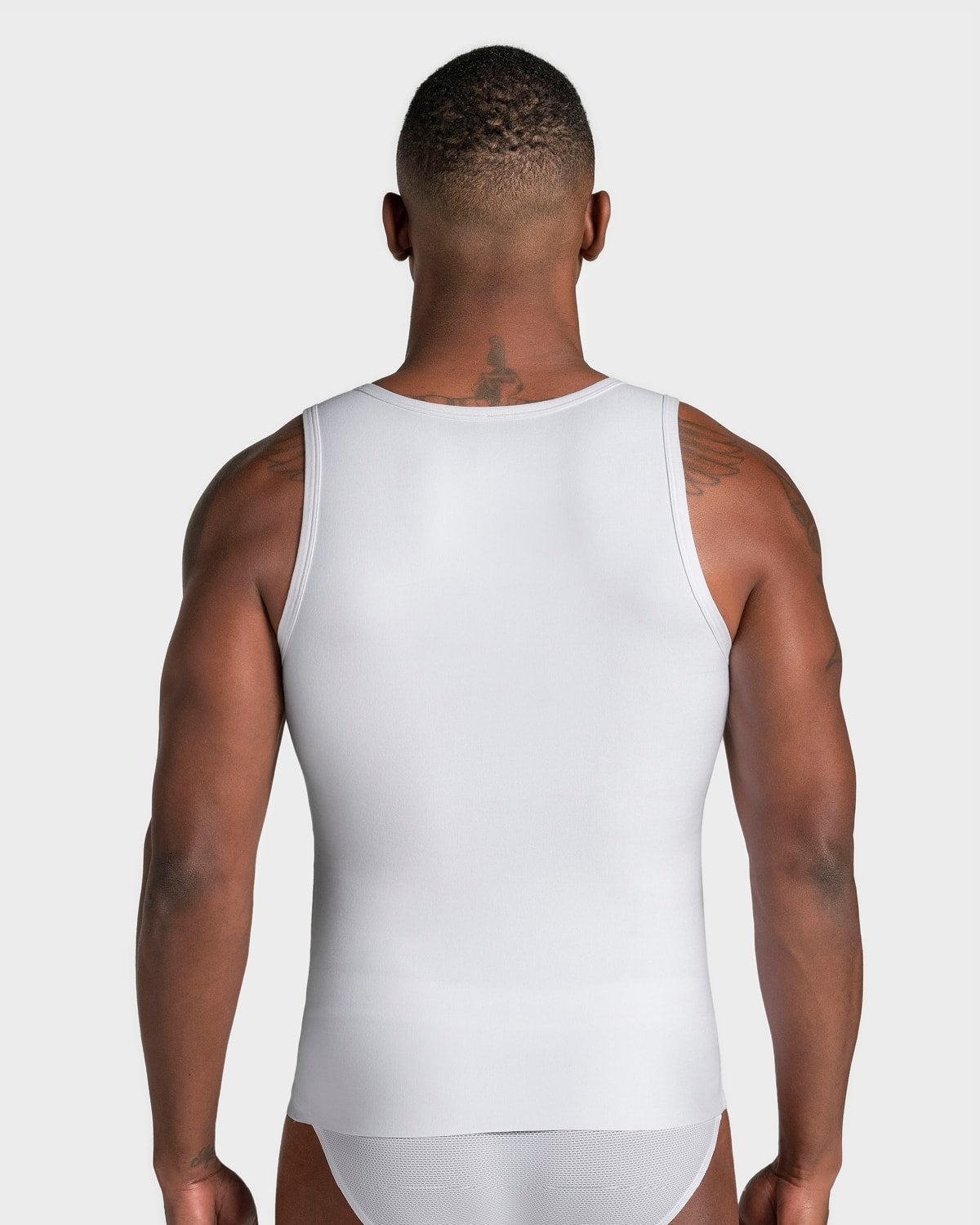 Camiseta sin mangas de compresión fuerte ideal para uso diario en algodón elástico#color_000-blanco